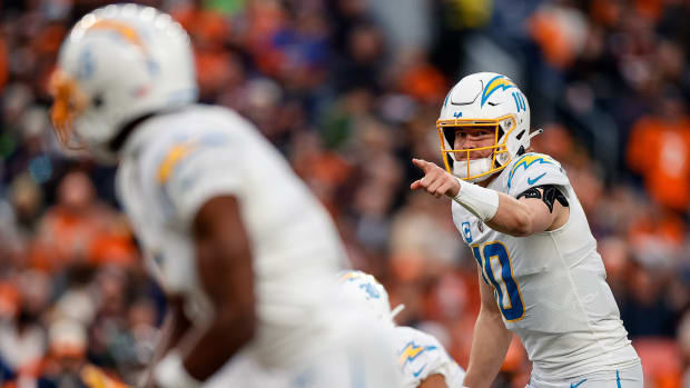 Jan 8, 2023; Denver, Colorado, USA; Los Angeles Chargers quarterback Justin Herbert (10) gestures at the line of scrimmage in the third quarter against the Denver Broncos at Empower Field at Mile High. Mandatory Credit: Isaiah J. Downing-USA TODAY Sports